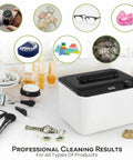Hassle Free 45KHz Ultrasonic Jewelry Cleaner With Six Time Modes Cleans Rings Eyeglasses Watch Straps And Dentures Pretty Quick on a vanity with various items.