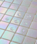 Close-up of Rainbow Peel And Stick Glass Tile Backsplash Kit For Kitchen And Bathroom with glossy white mosaic tiles.