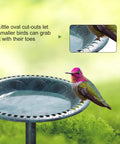 Close-up of Solar Powered Pedestal Bird Bath Fountain With Steel Ground Anchors, Weather Resistant Resin, Antique Green Outdoor Garden Decor with a bird