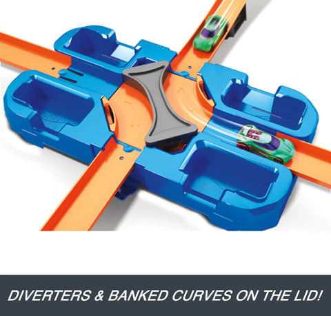 Blue and orange track with car, part of Deluxe Stunt Box Track Builder Playset With 25 Parts And A 1 To 64 Scale Vehicle Easy Build.
