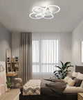 Six Ring Modern LED Ceiling Light Flush Mount with White Rings, 4000K Daylight fixture in a contemporary bedroom setting