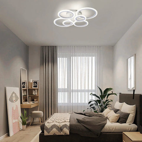Six Ring Modern LED Ceiling Light Flush Mount with White Rings, 4000K Daylight fixture in a contemporary bedroom setting