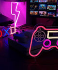 PS Controller Neon Light Sign For Gaming Rooms With Dimmer, LED Wall Decor beside gaming console setup