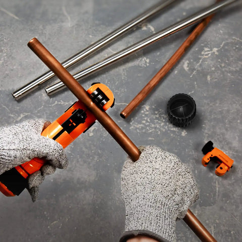 Fast Tubing Cutter Set With Mini Cutter And Deburring Tool For Quick Cuts On Three Sixteenths To Two Inches Aluminum Copper PVC Stainless Steel Tubes Perfect For Plumbers And Home DIY Projects in use on copper pipe