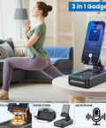 Two In One Bluetooth Speaker Phone Stand For Desk with phone in stand, woman doing yoga in background, home setting, 3-in-1 gadgets