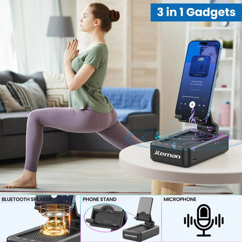 Two In One Bluetooth Speaker Phone Stand For Desk with phone in stand, woman doing yoga in background, home setting, 3-in-1 gadgets