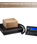Digital Postal Shipping Scale That Crushes It 110 Lb 50 Kg To 0.1 Oz 2 G Precision with box on scale and wall mount display