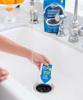 Foaming Garbage Disposer Cleaner Twenty Pack With Lemon Scent deep cleaning packet being used in a sink