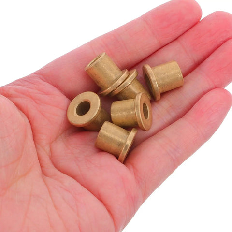 Six Piece Flanged Copper Sleeve Bearings With Step Shoulder Flange And Wrapped Brass Bushings in hand, showing sizes and details.