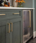 Super Sleek Contemporary Cabinet Drawer Pull With Champagne Bronze Finish And Killer Modern Hardware Design For Your Top Notch Kitchen Upgrade Featuring Effortless Glide Mechanism And 5 1/16 Inch Center To Center Mounting Spacing on green kitchen cabinet.