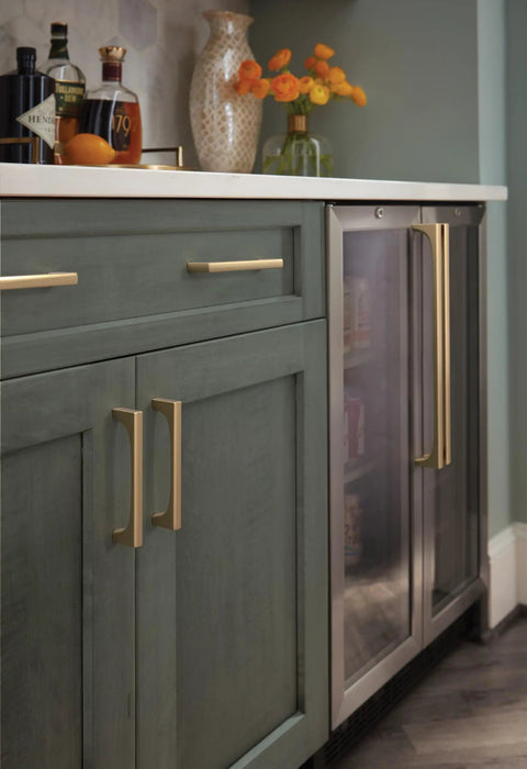 Super Sleek Contemporary Cabinet Drawer Pull With Champagne Bronze Finish And Killer Modern Hardware Design For Your Top Notch Kitchen Upgrade Featuring Effortless Glide Mechanism And 5 1/16 Inch Center To Center Mounting Spacing on green kitchen cabinet.