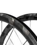 700C Road Bike Carbon Wheelset With 40mm UD X Weave Aero Rims And Rim Brake Surface, close-up of carbon fiber rim design.