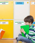 Children sitting near cubicles with 40 Pack Clear Self-Adhesive Desk Nameplate Pockets, 10.3 x 3.15 Inches, visible on each.