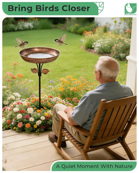 Man sitting in garden near Sturdy Metal Bird Bath Garden Stake With 12 Inch Bowl Outdoors 0.7 Gallon Capacity Yard Decor For Birds No Fuss Setup And Durable Weatherproof Design Included.