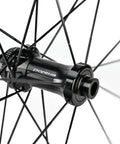 Front hub detail of Carbon Fiber Wheelset For Road Bikes 700c Disc Brake Tubeless 50 By 28mm UD Matte Black Decals Ultralight And Ultra Strong