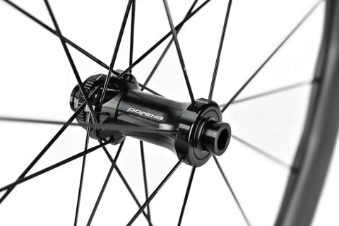 Front hub detail of Carbon Fiber Wheelset For Road Bikes 700c Disc Brake Tubeless 50 By 28mm UD Matte Black Decals Ultralight And Ultra Strong