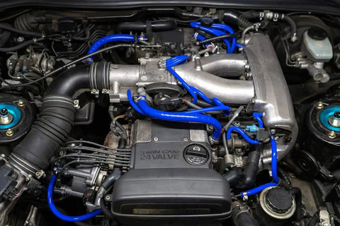 Get Your Ride Pumping Hard With This Blue Reinforced Silicone Vacuum Hose Kit That Beats The Stock OEM Rubber And Handles Sweet High Temps For Street Or Race Without Failing. Toyota Supra MK4 engine bay blue silicone vacuum hoses