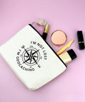 Im Not Lost Geocaching Gift Makeup Bag For Women Travel Essentials Zipper Pouch on pink surface with cosmetics
