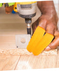 100 Pack Latex Protective Finger Sleeves shielding fingers during drilling tasks, breathable comfort and grip for work.