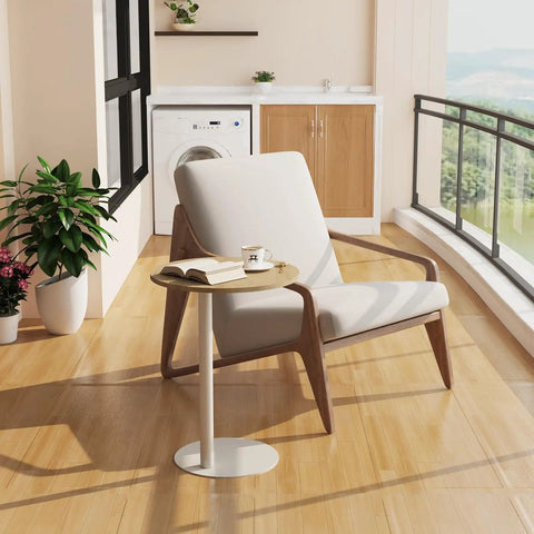 C Shaped Round End Table With Metal Legs For Couch in rustic oak beside a cozy chair on a wooden floor near a window.