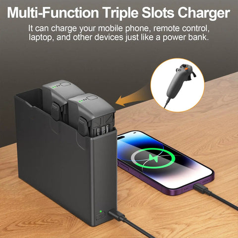Avata 2 Battery 2 Pack With Charging Station And Two Way Charging Hub with smartphone and remote on wooden table