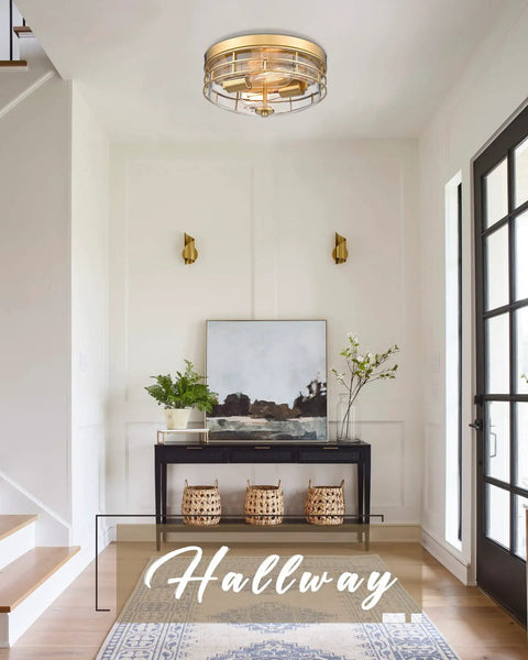 13 Inch Flush Mount Ceiling Light Fixture With Clear Glass And Brushed Gold Finish Modern Farmhouse Style For Entryway Bedroom Kitchen And Hallway Dimmable For Custom Ambience Upgrade Your Space Brighten Your Home in a stylish hallway setting with art and plants.