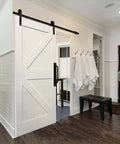 8 Piece Metal Barn Door Pull Set With Flat Head Long Base Design in black installed on white bathroom door