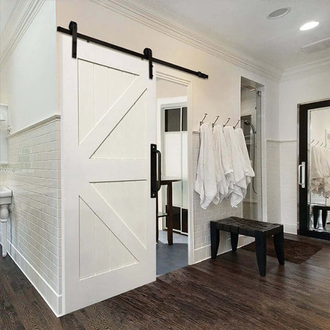 8 Piece Metal Barn Door Pull Set With Flat Head Long Base Design in black installed on white bathroom door