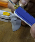 All In One Knife Sharpening Kit That Seriously Handles 6 Stones For Straight And Serrated Blades angle guide in use