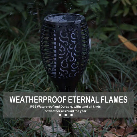 Close-up of Six Pack Solar Torch Lights With Realistic Flickering Flame LED in rain, showcasing weatherproof design and durability.