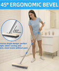 Person using Stainless Steel Wire Scrub Brush With A 62 Inch Long Handle for heavy duty cleaning with ergonomic design in a bathroom.