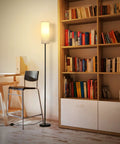 Tall RGB Smart Floor Lamp for living room, 67 inch dimmable lamp with remote next to bookshelf, emitting warm light.