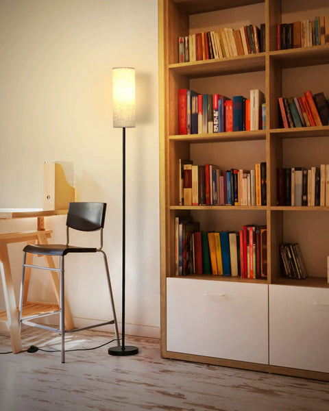 Tall RGB Smart Floor Lamp for living room, 67 inch dimmable lamp with remote next to bookshelf, emitting warm light.
