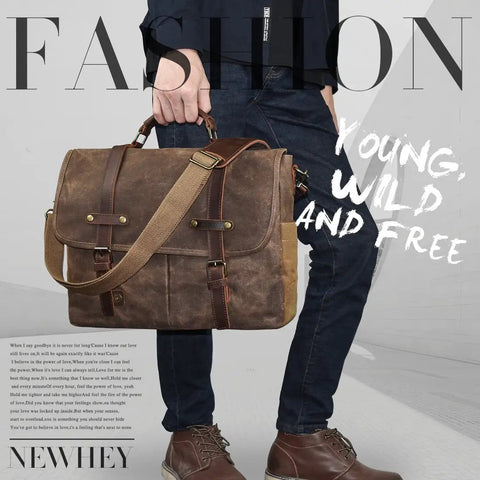 Top Tier Mens Messenger Bag Built Tough From Crazy Horse Leather And Hella Waterproof Waxed Canvas With Secure Compartments Fits 15.6 Inch Laptop For Daily Commute Work held in hand with a shoulder strap.