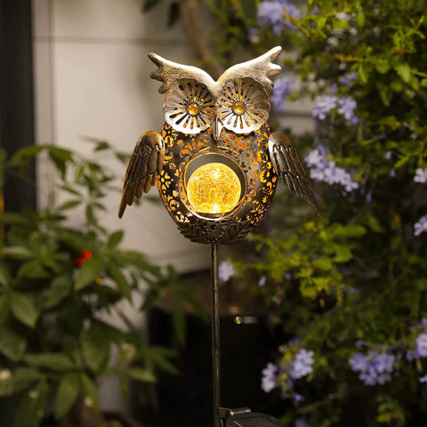 Solar Owl Garden Stake Lights For Lawn And Pathway, bronze crackled glass owl light with adjustable wings in a garden setting