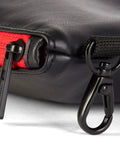 Close-up of zippered golf pouch with red trim, metal clip, showing premium synthetic material. Zippered Golf Pouch For Travel Gear.