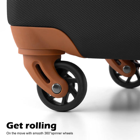 Luggage spinner wheel close-up on a brown frame of a black textured hardside suitcase.