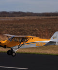 Carbon Cub 15cc ARF Ready To Fly RC Plane With Laser Cut All Wood Construction in flight on runway with tundra wheels