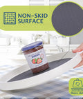 Set Of 4 10 Inch Rotating Lazy Susan Organizer With Non Skid Beaded Surface And No Slip Feet showcasing gray surface with jam jar