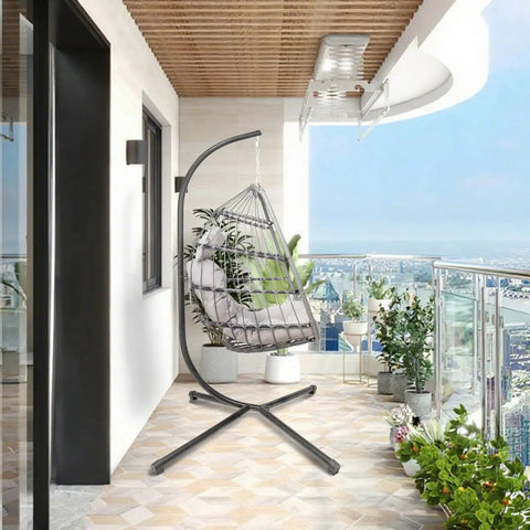 Outdoor Hanging Egg Chair With Stand For Patio And Garden Cozy Weatherproof Wicker Hammock Chair With Plush Cushion And Durable Steel Frame on balcony