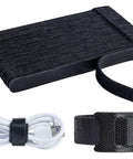 Black stack of 120 Pack Reusable 6 Inch Hook And Loop Cable Ties with one tie securing a white USB cable, ideal for cable management.
