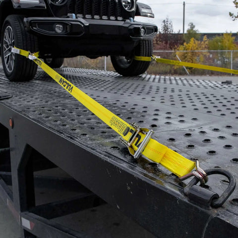 Ratchet Straps With Wire J Hooks, 2In x 15Ft, Four Pack, Classic Yellow Webbing securing a vehicle on flatbed