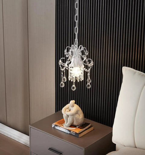 Crystal Chandelier Pendant Light White 1 Light for hallways with crystal accents and adjustable chain over a nightstand.