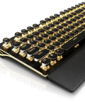 Slick Retro Typewriter Keyboard 108 Keys With Clicky Blue Switches And Yellow Backlight angled view with detachable wrist rest