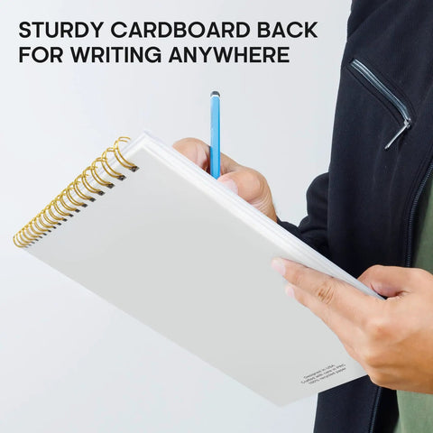 Person writing on To Do List Notepad For Work And Home, Undated Daily Planner With 52 Sheets, 9.8 by 6.5 inches, spiral-bound.