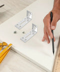 Six Pack Stainless Steel L Shaped Shelf Brackets With Slotted Holes adjustable corner braces on a table with measuring tools
