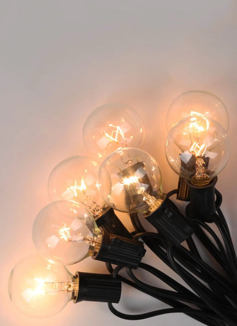Old School Edison G40 Replacement Light Bulbs 5W Clear Globe 1.5 Inch Dimmable Bulbs Fits E12 Candelabra Base glowing in dark