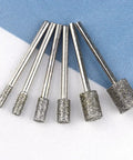 Pro Grade Diamond Grinding Burr Drill Bit Set One Eighth Inch Shank, close-up view of assorted cylindrical heads.
