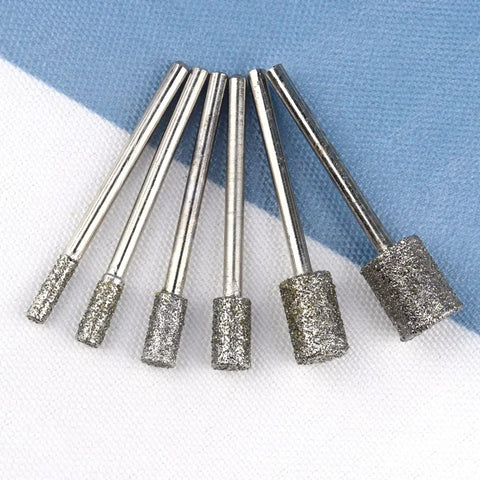Pro Grade Diamond Grinding Burr Drill Bit Set One Eighth Inch Shank, close-up view of assorted cylindrical heads.