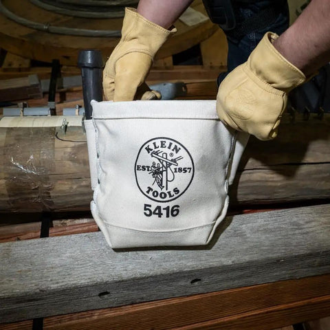 Small Tool Pouch For Bolt Storage With Bull Pin Loops On Each Side Built Tough In Durable No 4 Canvas With Belt Clip And Double Bottom 5 X 10 X 9 Inches Made In USA Perfect For Electricians And Techs On The Job held by gloved hands